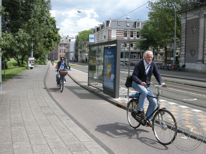 A bus-stop-bypass in Amsterdam (actually a tram stop bypass!). The cycle path runs around the rear of the stop, so people using it don't have to stop.