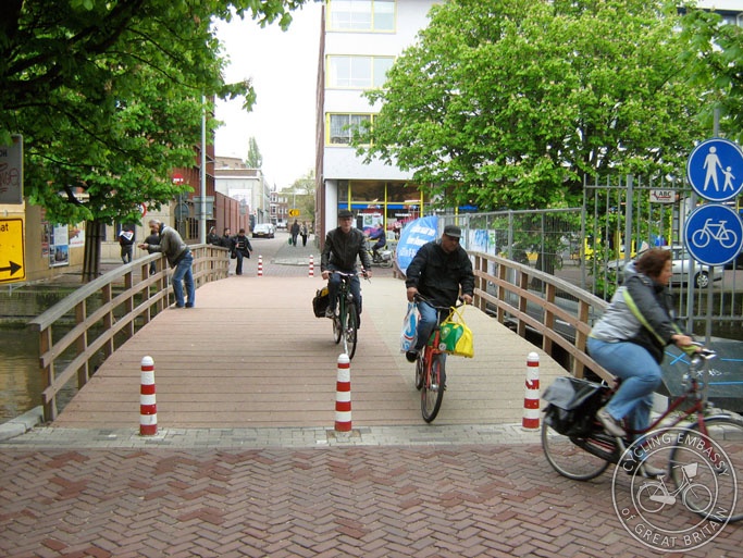 A photo of a wide but temporary walking and cycling bridge in The Hague, the Netherlands.