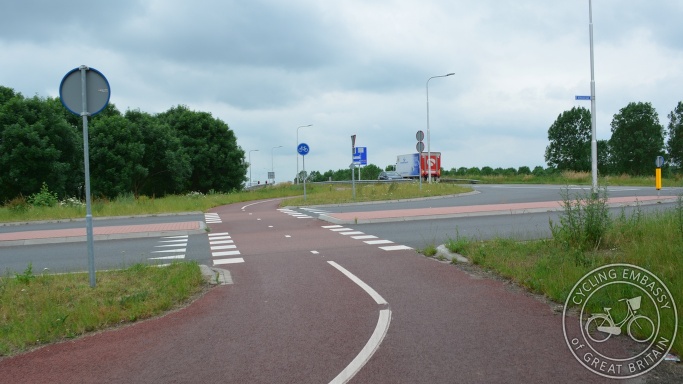 Bi-directional cycleway with clear priority across road, Elst, NL