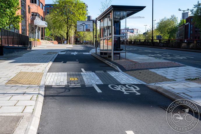 A bus stop bypass on a bi-directional cycle track with zebra crossings and angled kerbs